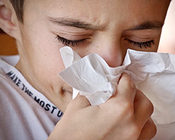 Child blowing his nose