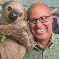 Bert Castro with a sloth at the Phonenix Zoo