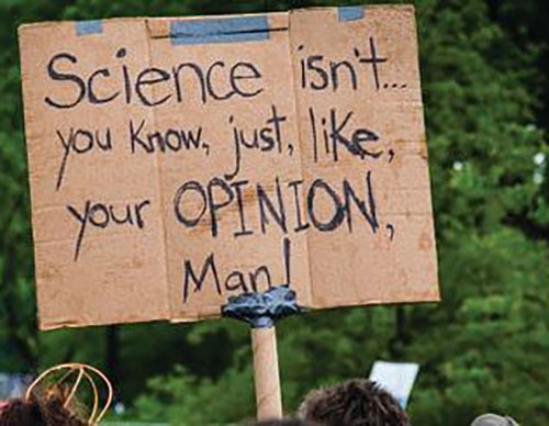 Handwritten cardboard poster - Science isn't you know, just like, your OPINION man!